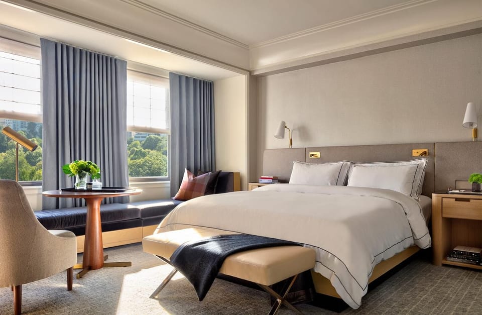 Drift off in a quiet, airy room with skyline glimpses.