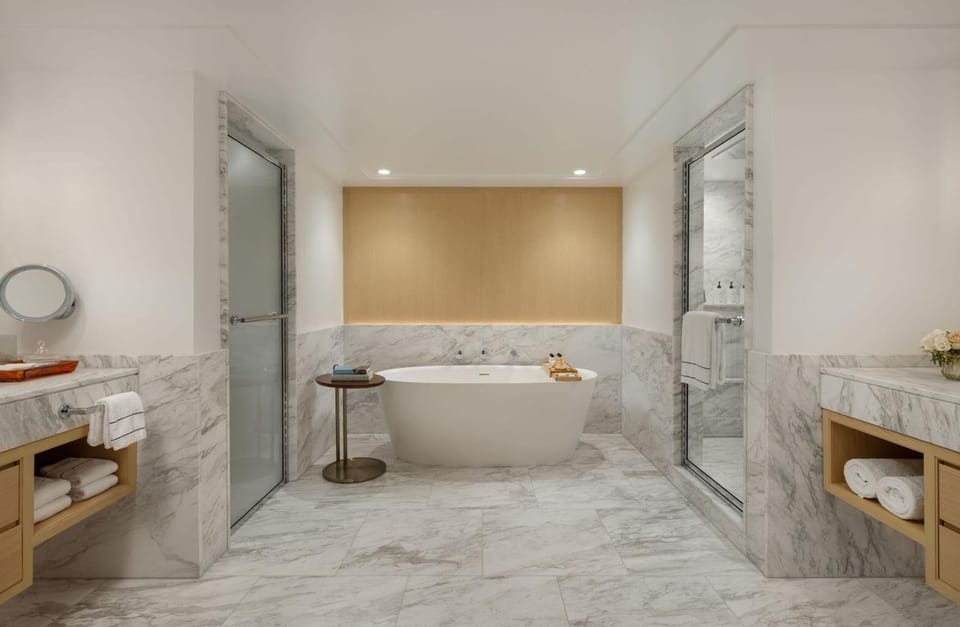 Indulge in a spa-like soak surrounded by marble elegance.