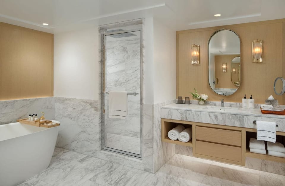 Rinse off in the sleek glass shower after a long day.