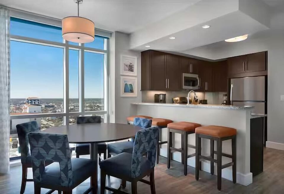 Cook and toast by floor-to-ceiling windows with skyline views.