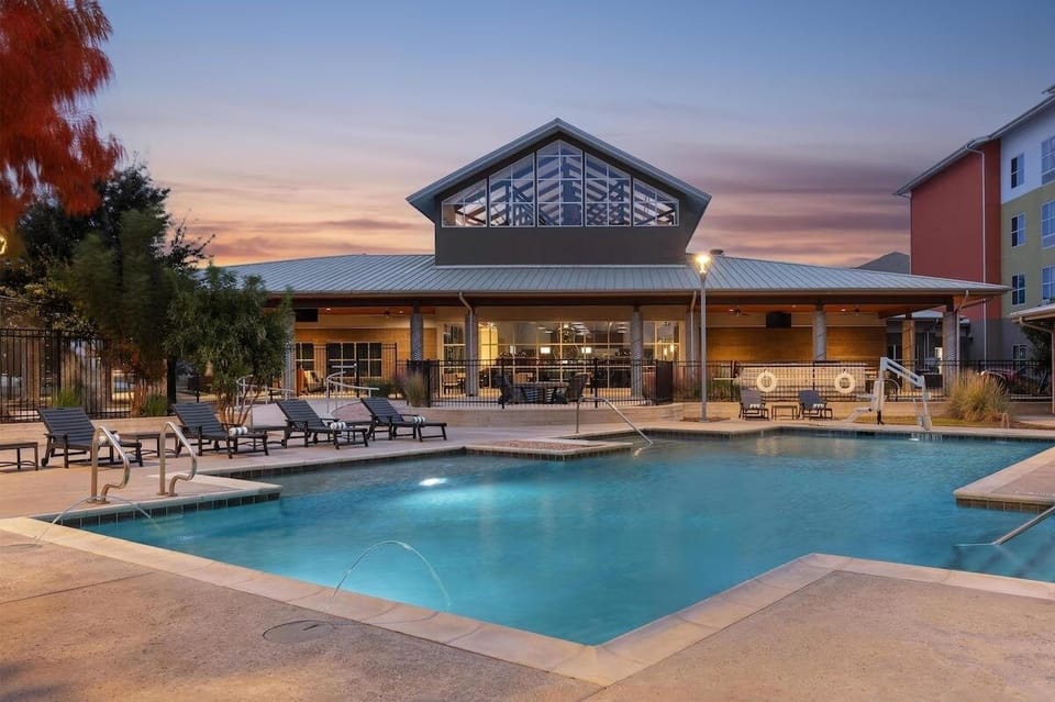 Dive into golden-hour bliss with a resort-style pool backdrop.