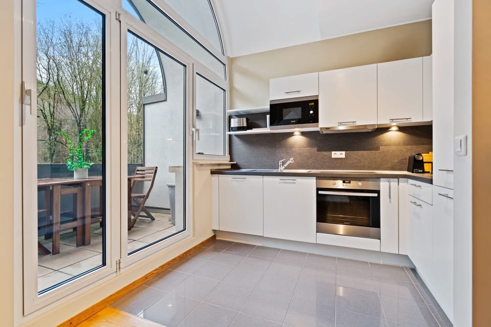 Prepare delicious meals in a kitchen that opens up to tranquil views.