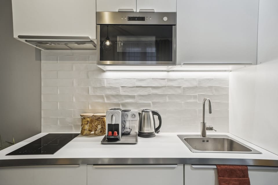The kitchen is fully equipped to prepare a simple meal