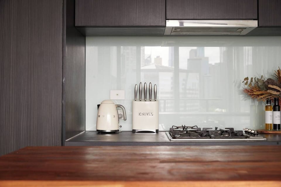 The chic kitchen has ample bench space with a kitchen island that doubles as a casual dining setting.
