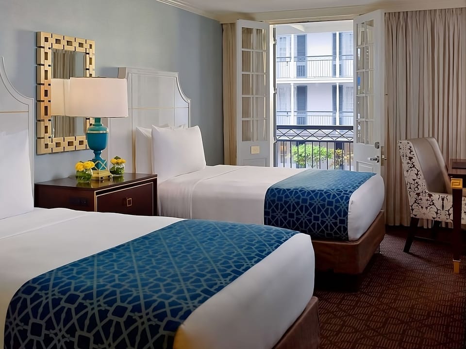 Wake up to sunshine and step onto charming balcony views.