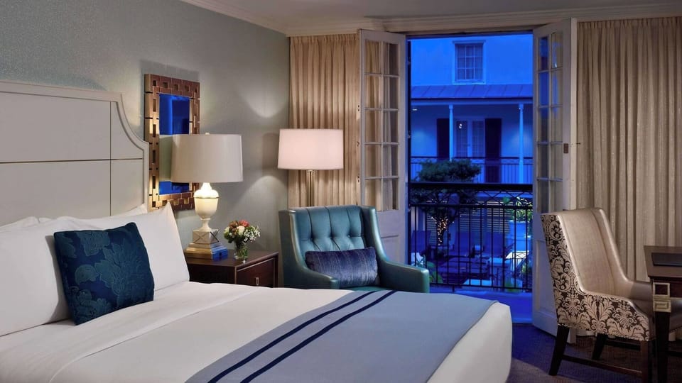 Step onto your balcony and savor evening courtyard views.