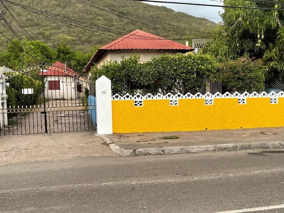 Outside gate entrance showing parking area
