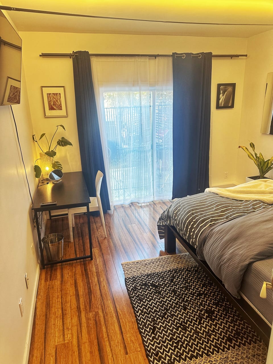 Bedroom with Cal King bed, and desk for working.