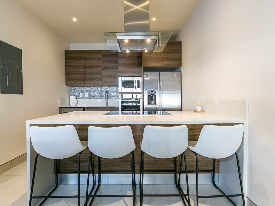 Bar seating at the kitchen counter—ideal for casual dining and conversation.

