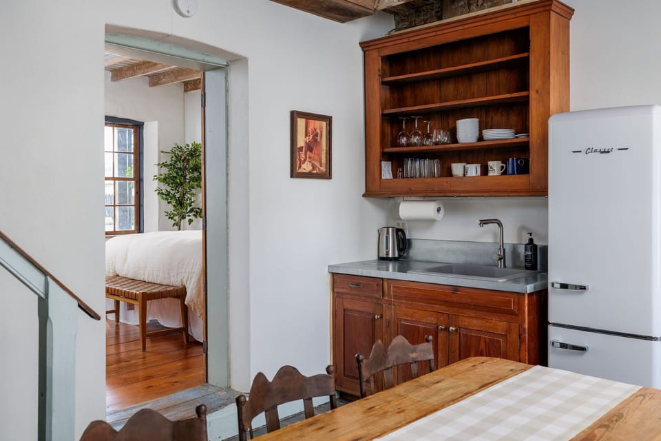 Prepare delicious meals in the charming kitchen, where vintage accents and modern conveniences come together in perfect harmony