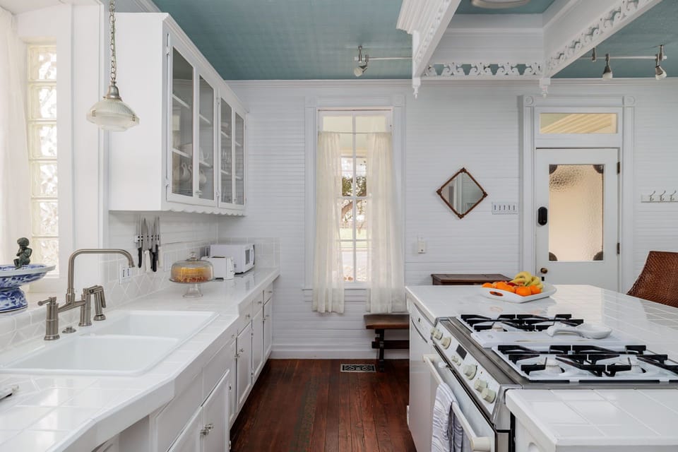 Experience the joy of cooking in our spacious kitchen, complete with a convenient island, stainless steel appliances, and all the tools you need to whip up delicious meals