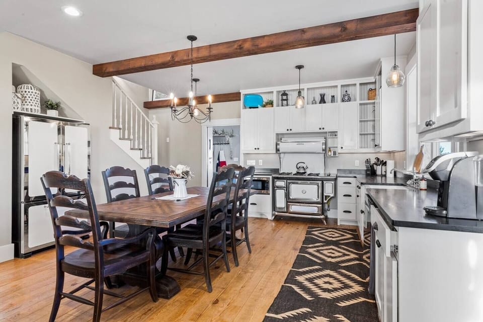 Fully stocked kitchen and a dining table for everyone to sit at