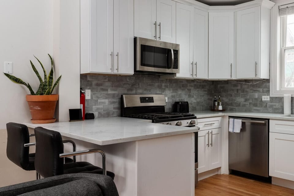 Enjoy breakfast or catch up on emails at the kitchen island with convenient barstool seating