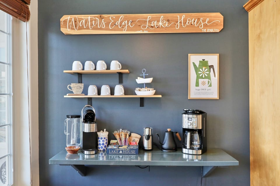 Coffee bar with Keurig, regular coffee pot, coffee grinder and electric teapot.