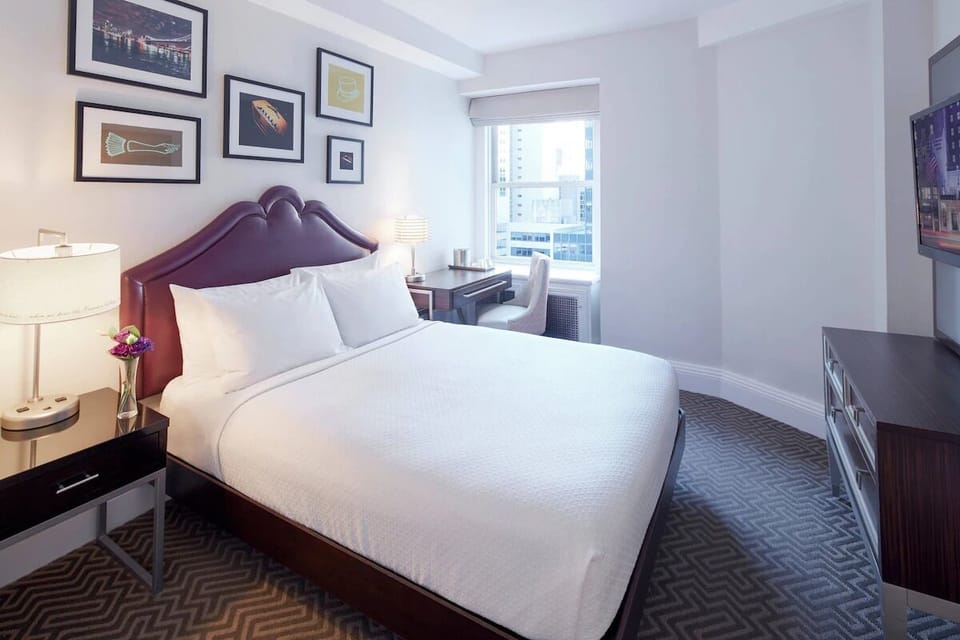 Unwind in crisp linens after a vibrant city day.