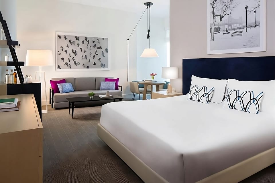 Wake up to skyline views from a plush king bed.