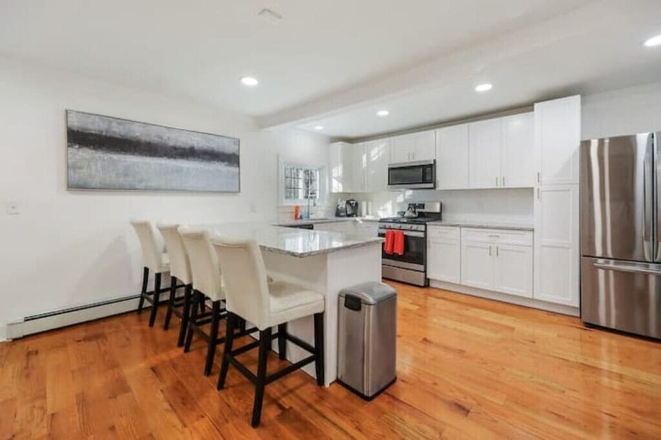 Well-appointed kitchen with stainless steel appliances. Dining area seats 4.