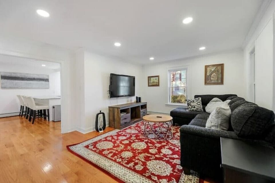 Cozy living room nestled between the oversized kitchen and four-season porch.