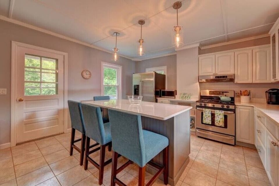Well-appointed kitchen with an oversized island that seats four people.