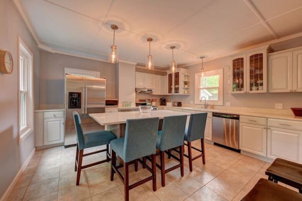 Well-appointed kitchen with an oversized island that seats four people.