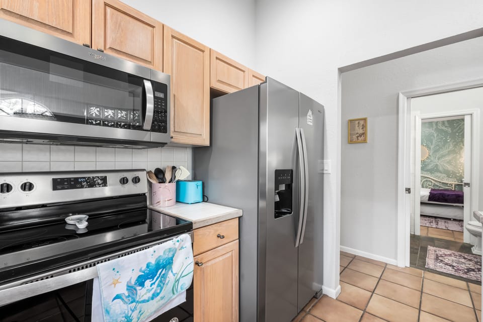Modern kitchen equipped with stainless steel appliances and cabinetry