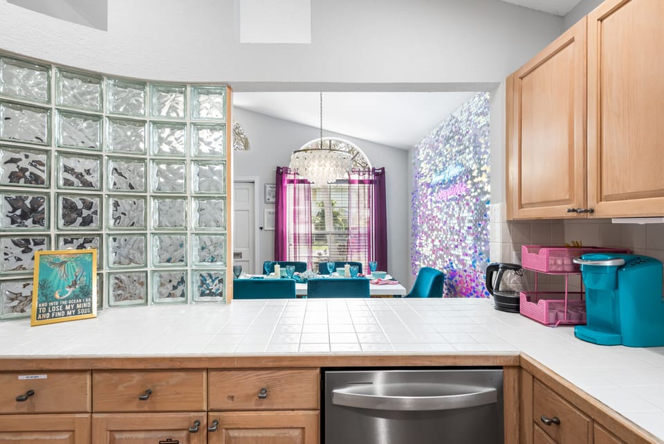 A view from the kitchen showcases a sparkling dining area