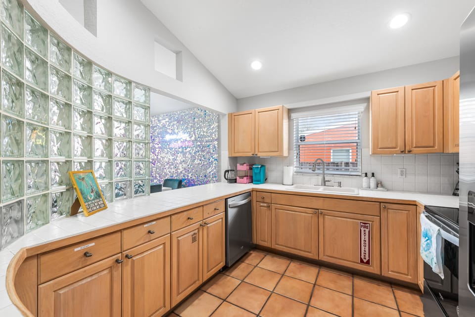 This kitchen provides natural light, with a glass block detail on the side