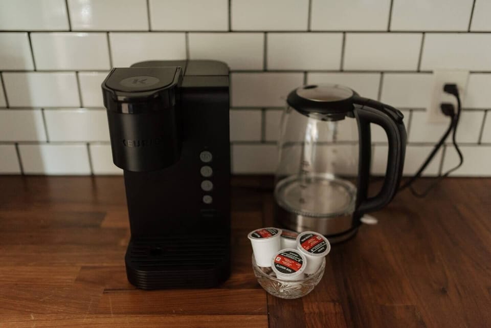 Keurig coffee machine for your convenience. Coffee and tea are provided.