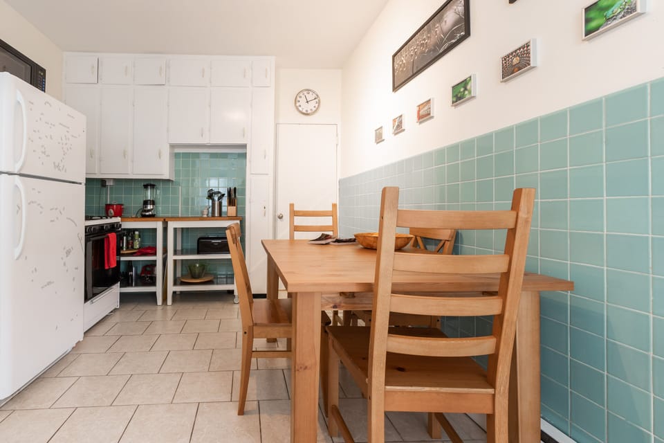 Kitchen: an oven, stove, and a fridge.