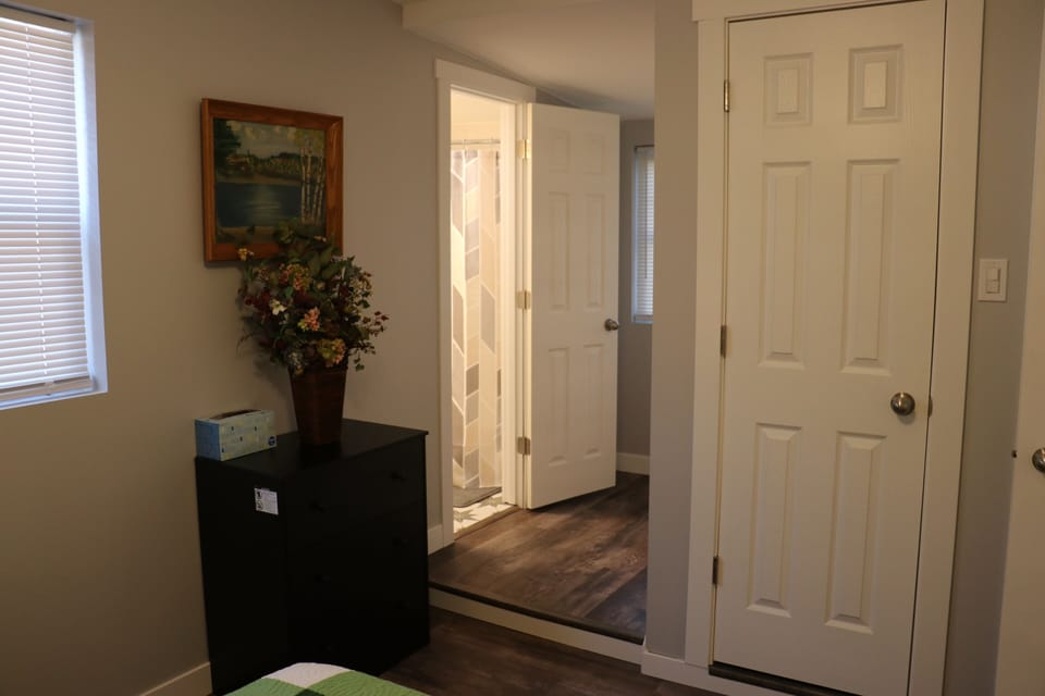 Master Bedroom with dresser, closet and private bathroom (3)