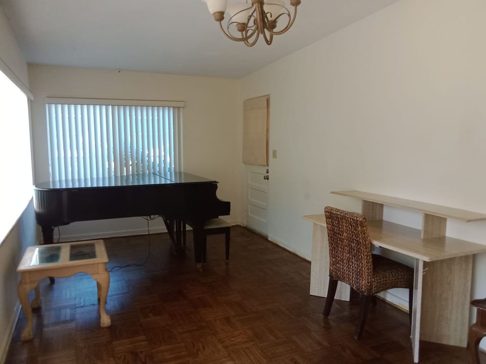 Piano room and desk with chair
