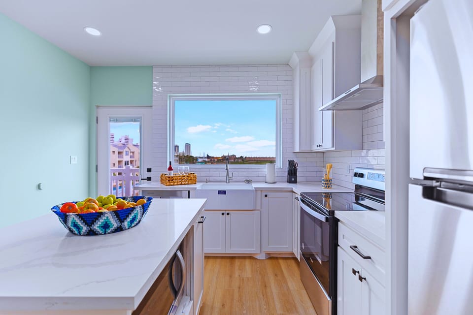 The sleek chef’s kitchen features a spacious waterfall island and elegant designer finishes. Outfitted with high-end appliances and fully stocked essentials, it’s designed for everything from effortless snacks to gourmet creations.
