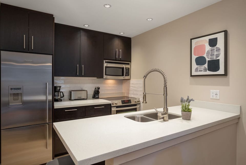 Enjoy cooking up your favorites in the fully stocked kitchen with modern appliances.