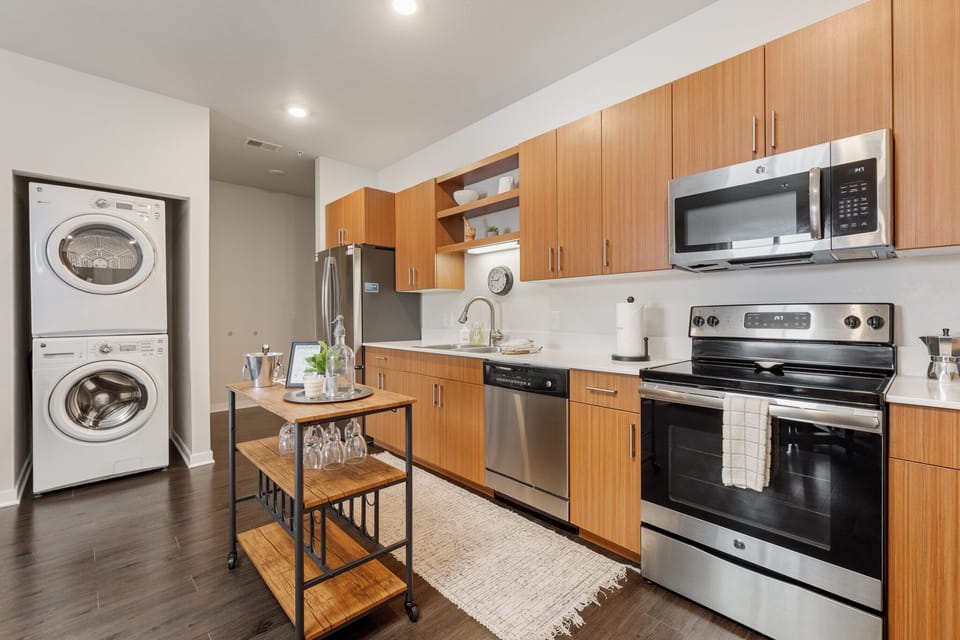 Spacious kitchen w/ stainless steel appliances & in-unit washer & dryer