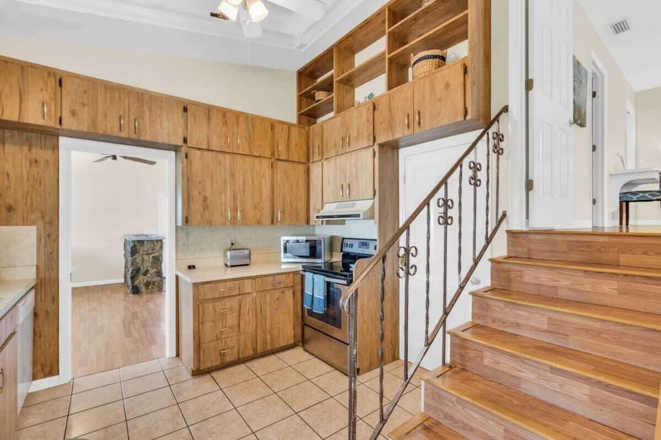Kitchen and steps to Primary Bedroom