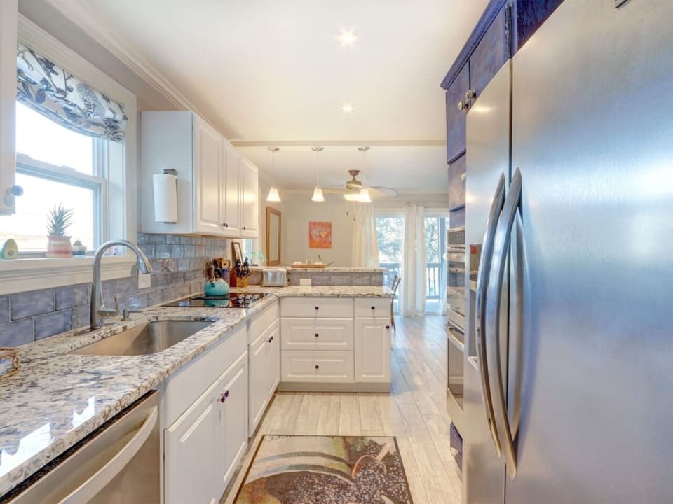 BLue Marlin by You`re On Tybee Tyme Properties large kitchen, lots of counter space, fully stocked.