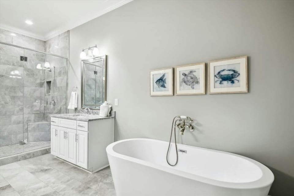 After a fun day on the beach, sink into the soaker tub with a glass of wine.