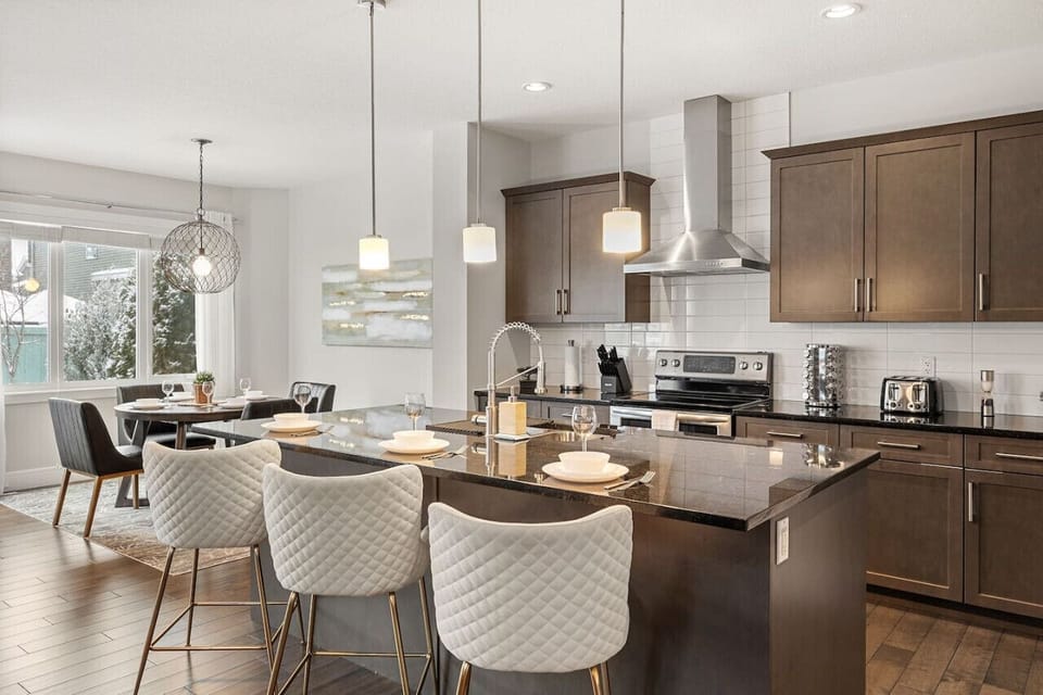 Fully-equipped kitchen, boasting a spice rack, ice maker, modern appliances, and a coffee machine for your morning brew.