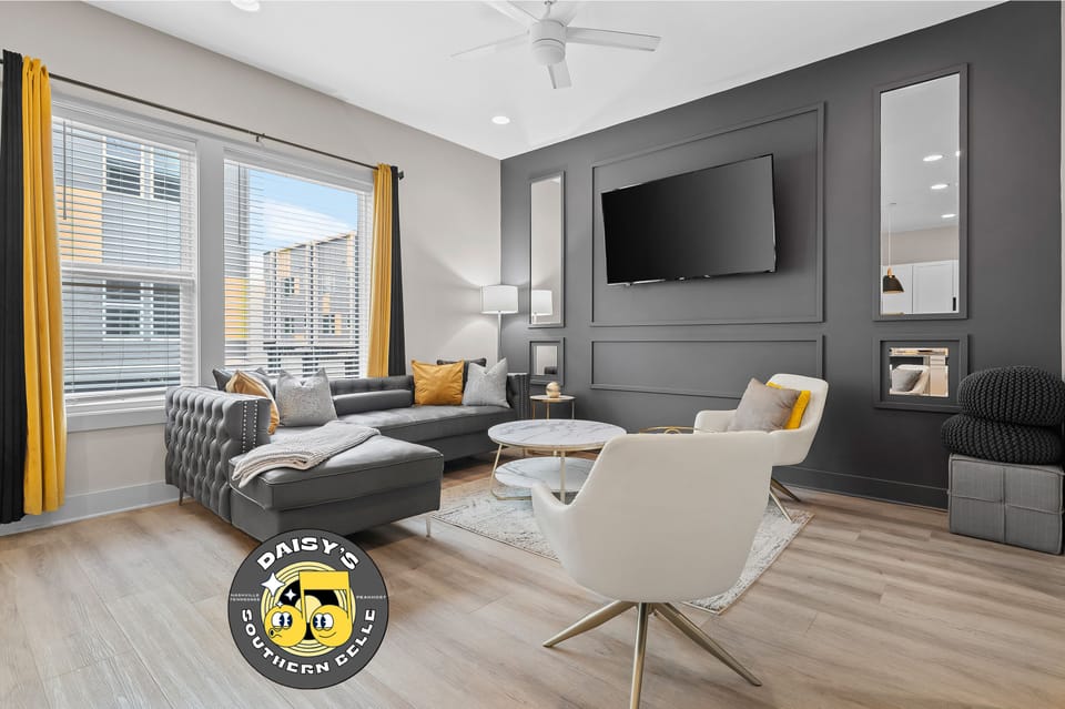 Relax in style in Daisy's modern living room with a touch of southern charm. ️