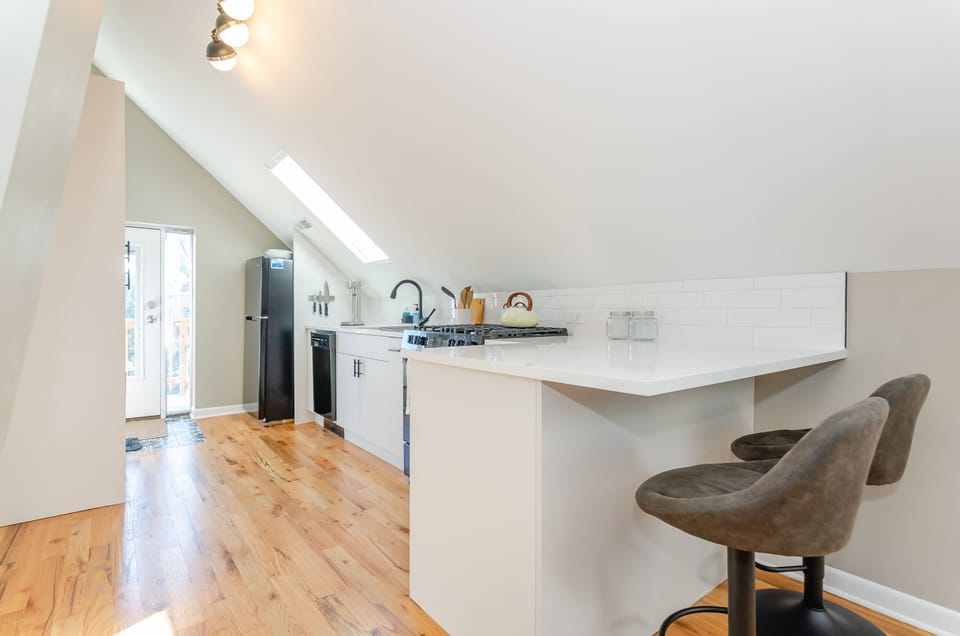 Open kitchen with counter seating for 2