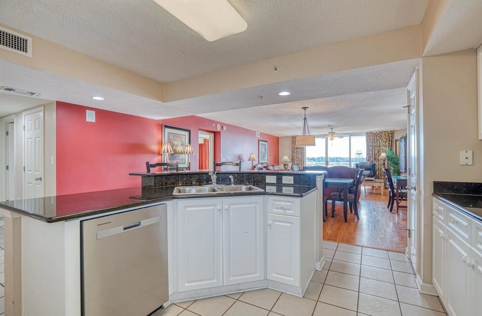 White kitchen with upper cabinets and microwave