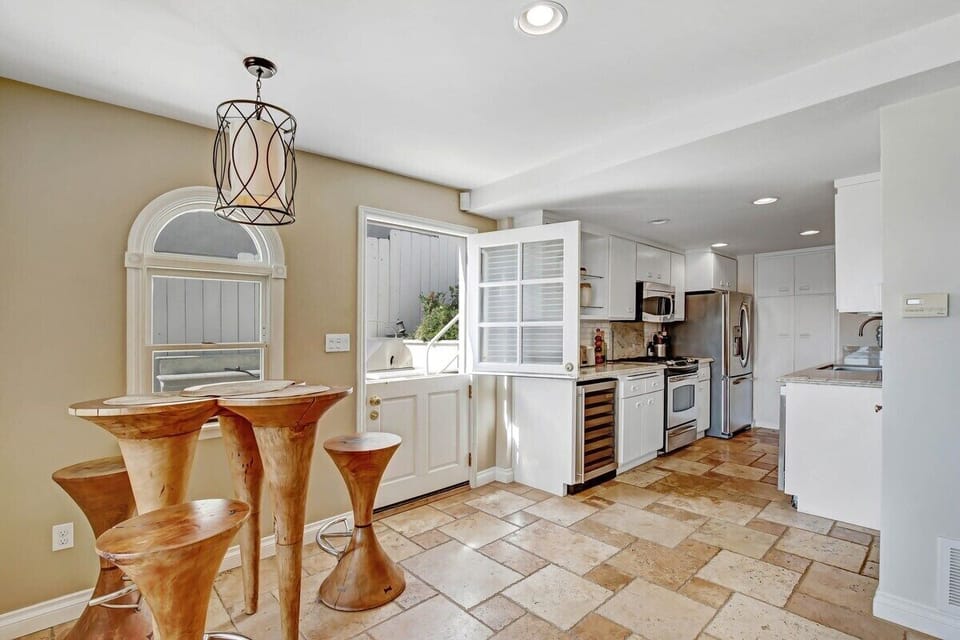 Lower floor kitchen and sitting area, Door to BBQ