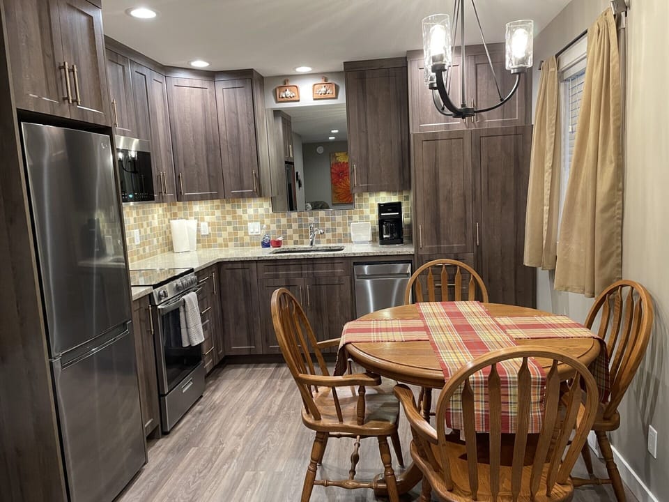 Well stocked kitchen. Fridge with bottom freezer. Full size stove with oven.