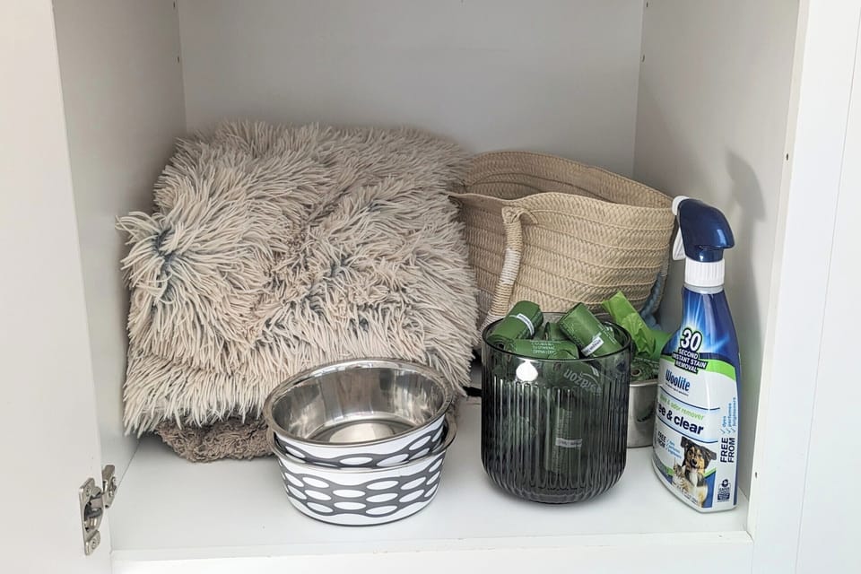 Dog bowls, baggie, and blankets for your four-legged family.