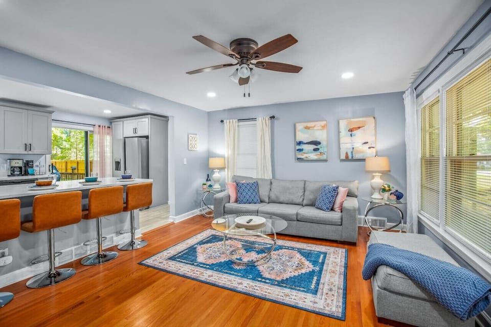 Our living room has comfy seating with beautiful exterior views of our tree lined front yard.