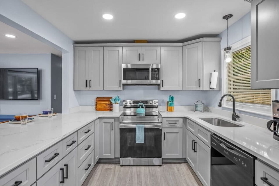 Our kitchen has a lovely view of the back yard and is also open to the living room so that you and your friends and family aren`t closed off from one another when cooking.