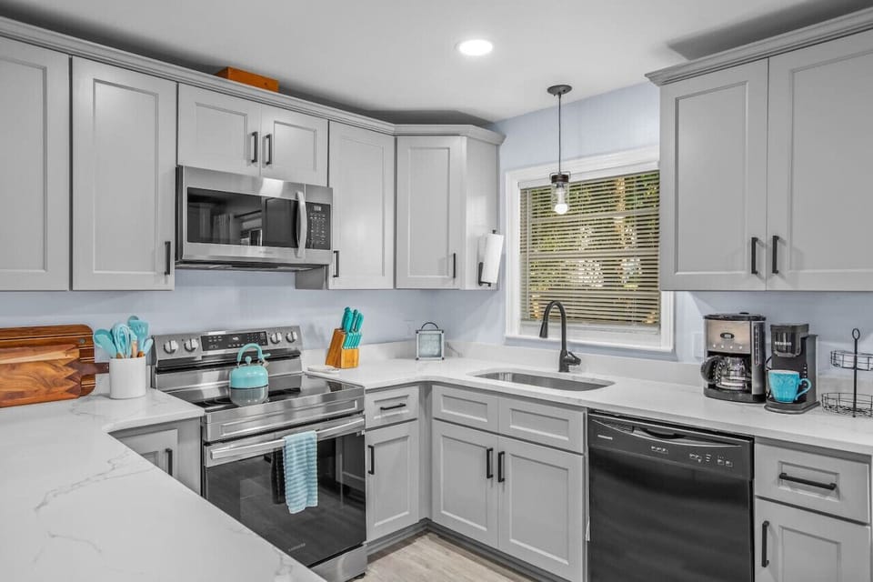 This newly remodeled kitchen provides ample counter space for prep work.  The kitchen is fully stocked with cookware, utensils, and bakeware so that you can prepare a full meal.