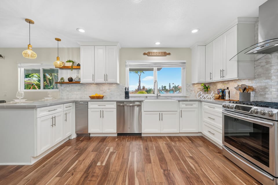 Cook with ease using stainless appliances, quartz counters, and a gas range