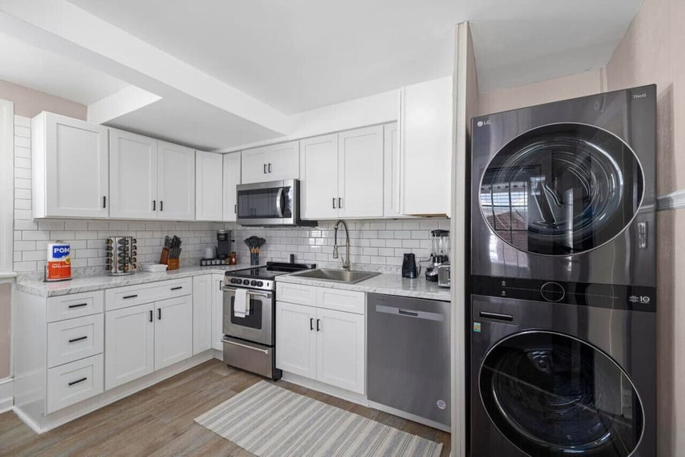 A modern kitchen and laundry set up.