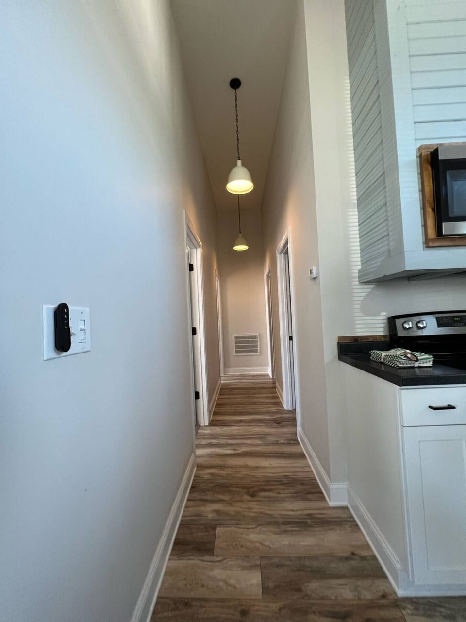 Hall leading to bedrooms & bathrooms, from living room/kitchen.
